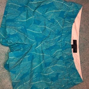 blue shorts with green leaves